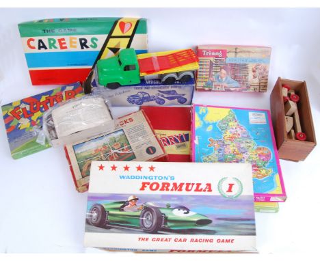 TOYS AND GAMES: A large quantity of assorted vintage toys and games to include; a Tudor Rose boxed plastic truck, other plast