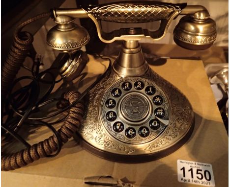 The Duchess, push button telephone with a solid, brass finish and traditional cloth handset curly cord. Compatible with stand