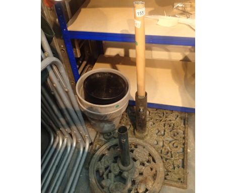 Two large cast metal garden parasol bases and some pots. Not available for in-house P&amp;P, contact Paul O'Hea at Mailboxes 