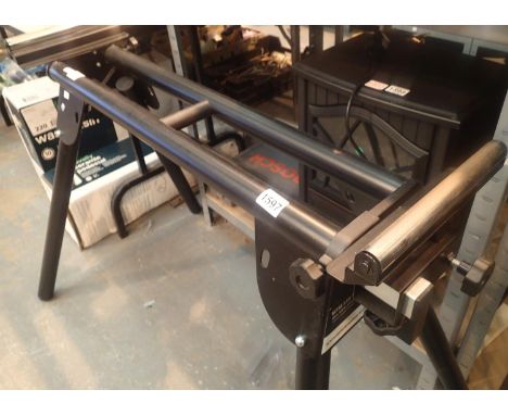 Evolution saw bench with adjustable height and length and roller at each end.  In working order at time of lotting. Not avail