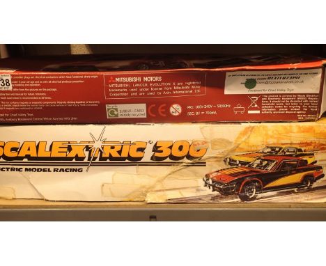 Boxed Scalextric 300 model racing set and a Chad Valley looping challenge racing set. Not available for in-house P&amp;P, con