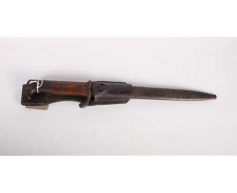 A WWII German bayonet with saw back blade stamped E & F Horster, in steel scabbard with leather frog