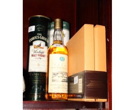 A bottle of Islay 13 year old single malt Scotch whisky, a bottle of Laphroaig 10 year old Scotch whisky, a bottle of 1989 Fa
