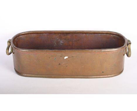 A 19th Century copper and brass two-handled oval planter, 18" wide