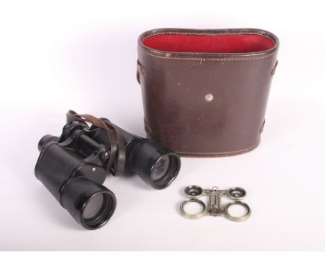 A pair of Lieberman Gortz 7x50 binoculars, in leather case, a pair of folding pocket binoculars and a Eumig cine camera