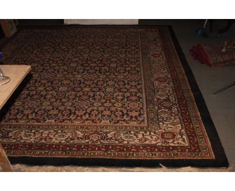 A Persian design carpet decorated Herati pattern and four border stripes, 144" x 108" approx