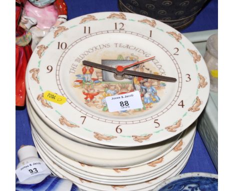 Nine Royal Doulton "Bunnykins" side plates, 8" dia, a similar feeding bowl and a teaching clock