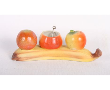 An assortment of ceramic cruets, etc
