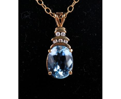 A 9ct gold, diamond and aquamarine pendant on chain and a rolled gold pendant on chain set synthetic amethyst coloured stone
