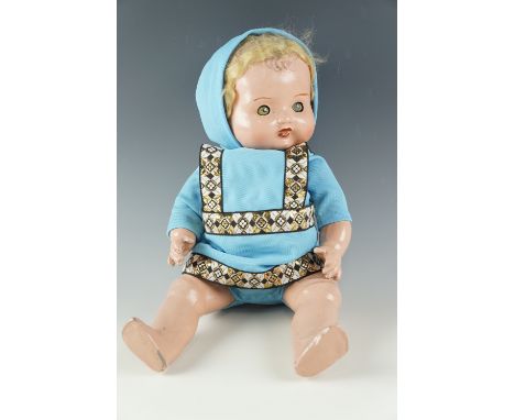 A vintage painted ceramic composition doll, having sleeping eyes, "real" hair and an articulated body, circa 1930s, (costume 