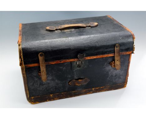 A small early 20th Century leather bound canvas covered trunk, having a Royal Navy button to inner pouch, (a/f), 54.5 x 36 x 