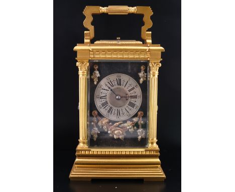 A late 19th Century repeating gilt metal carriage clock, having a key wind and set two train movement striking on a gong, the