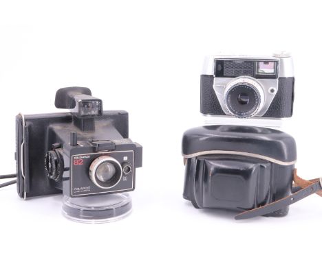 An Olympia "Regula Auto - Set II" camera together with a Polaroid "Colorpack 82" land camera