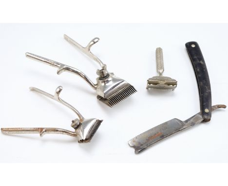 A vintage cutthroat razor together with two hair clippers and a safety razor