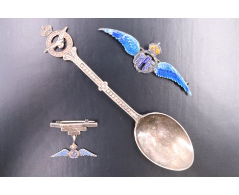 Two vintage RAF enamelled white metal sweetheart brooches marked 'Silver', together with a silver plated RAF souvenir spoon, 