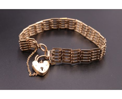 A 1960s 9 ct gold gate-link bracelet, having a padlock clasp, Birmingham, 1963, 16.73 g, 18.5 cm excluding padlock x 1 cm wid