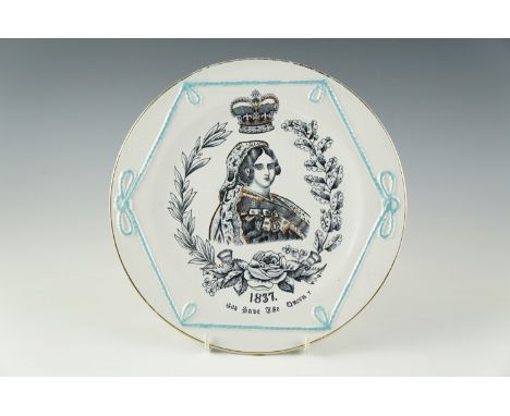 A Victorian coronation commemorative plate, moulded and transfer decorated with a portrait of Queen Victoria surrounded by oa