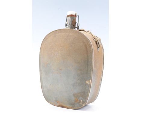 A vintage tinplate canteen with spring stopper bearing initials CFH, 25 cm
