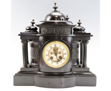 A Victorian black marble mantle clock, having a French drum movement by Mougin and striking on a gong, the dial with an expos