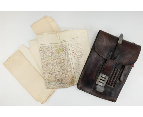  A German Third Reich Wehrmacht M 35 map case, unit marked 2. J. R. 16, together with contemporary maps of Germany