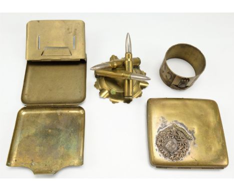 Four items of Great War commemorative "trench art" comprising two cigarette cases, a dish and a napkin ring