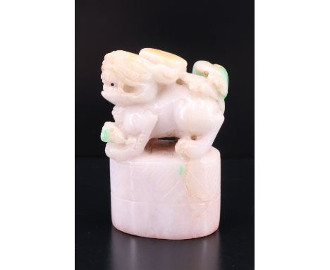 A Chinese carved jade seal, its top in the form of a guardian lion, 5 cm