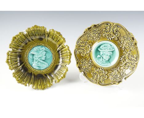 A 19th Century German majolica plate and dish, moulded decoration, each with a contrasting central portrait medallion of a bo
