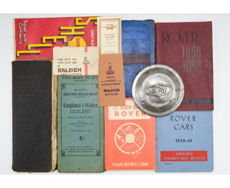 [ Classic car ] Vintage motoring maps, two Rover motoring manuals, relating to 1939, '49 and 1950 models, etc, and a Ford hub