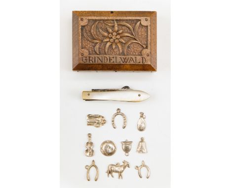 A vintage 'Grindelwald' carved walnut stamp box, a mother of pearl handled folding button hook and knife, and tinplate Christ