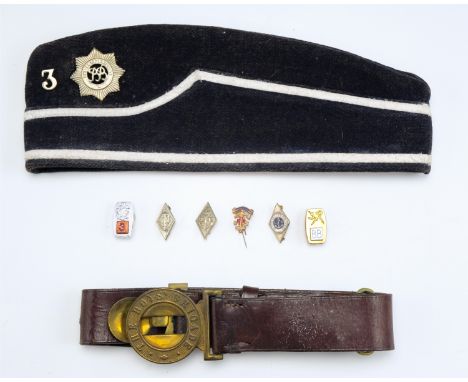 A vintage Boy's Brigade forage cap bearing conforming badge and numeral '3', a leather belt and enamelled and other badges in