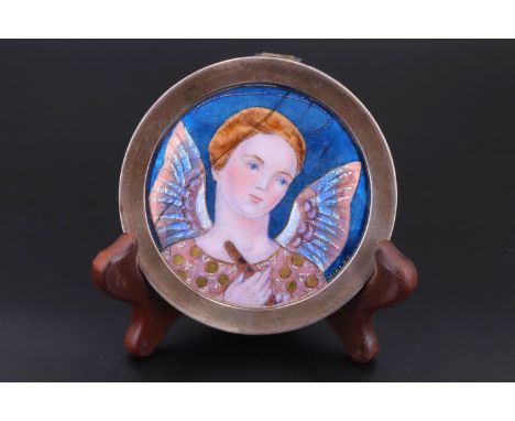 Núria Nialet (1924 -1984)  A study of an Angel holding a flute, glass enamel over foil and copper, subtly convex, signed "Nia