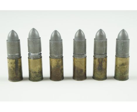 Six vintage toy gun cartridges, circa 1950s