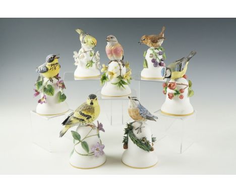Seven 1980s Franklin Mint ceramic bells by Peter Barrett, including "The Blue Tit", etc, 13 cm (one a/f)