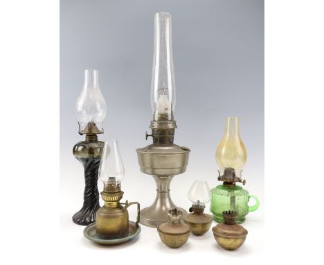 A Super Aladdin oil lamp, 60 cm together with a green glass finger lamp etc