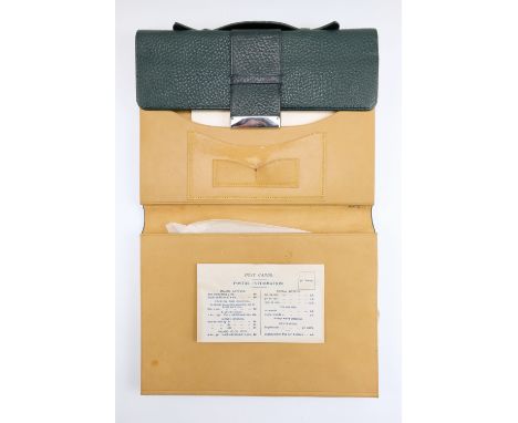 An as new vintage leather travelling stationary wallet, complete with sample stationary, blotting paper, a dip pen and a prop