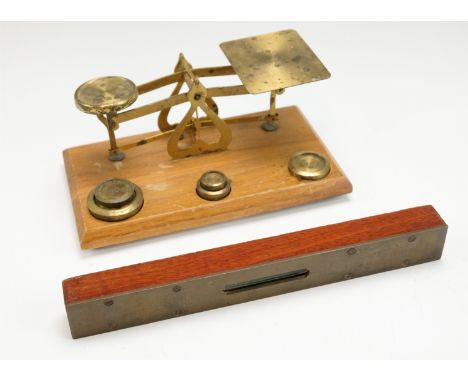 A set of late 19th / early 20th Century brass postal scales, the frame stamped "Warranted Accurate", together with six brass 