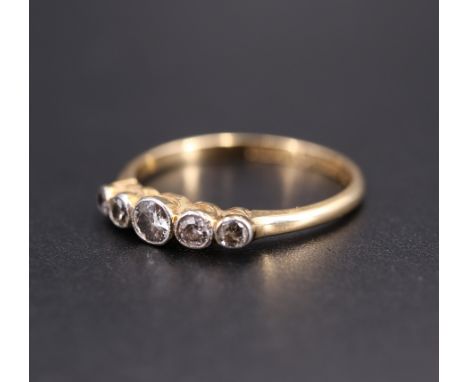 A vintage five-stone diamond ring, the small graded stones platinum collet set on an 18 ct yellow metal shank, circa 1920s - 