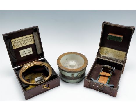 An early 20th Century Royal Navy Admiralty marine gimbaled compass together with two cased Royal Navy pattern 1152 Azimuth Ci