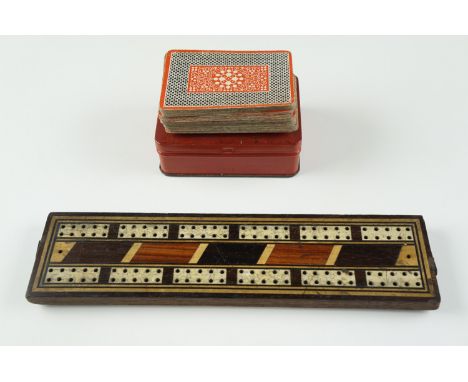 A late 19th / early 20th Century parquetry cribbage board, 25 cm, together with a set of Braille playing cards by Thomas de l