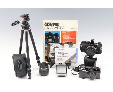 An Olympus OM-2 camera body together with a 1:1,8 f = 50mm lens, a Teleconverter 2X-A lens, a tripod, flash, instructions and