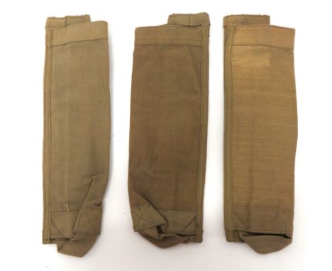 Three WW2 Webbing Mortar Ammunition Transit Bagskhaki webbing, cylinder tubes.  The rear with lower belt loop and central bra