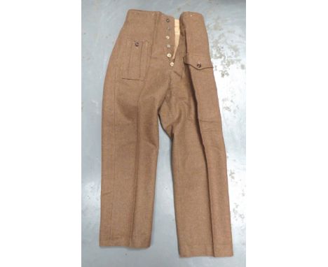WW2 1940 Pattern Battledress Trouserskhaki, woollen, wide leg trousers.  Right hip with first aid pocket.  Front of left leg 