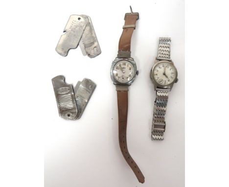 Two Military Used Wristwatchesplated watch with offset face often used by Dispatch Riders.   Chrome strap.  Interior with "44