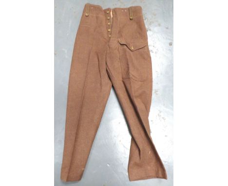 Pair Of 1946 Battledress Trouserskhaki woollen, wide leg trousers.  Large, front patch pocket with buttoned flap to left leg.