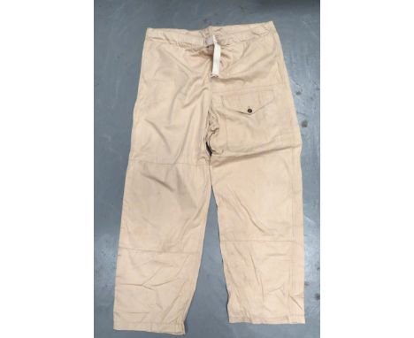 Pair WW2 Khaki Drill Windproof Overtrouserskhaki drill, wide leg over trousers.  Waist with cord tightening.  Left of front l