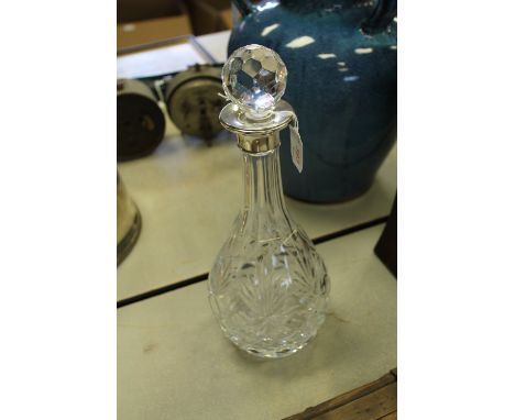 Silver mounted cut-glass decanter