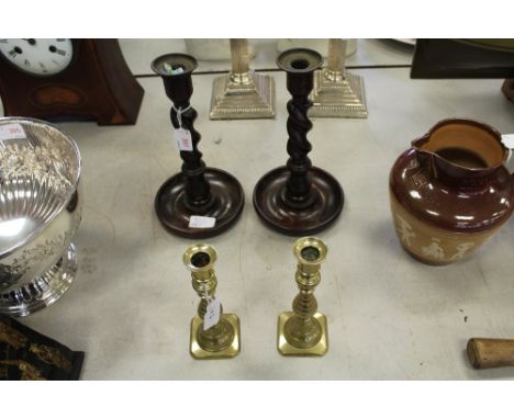 Pair of oak barley twist candlesticks and a pair of brass candlestick etc