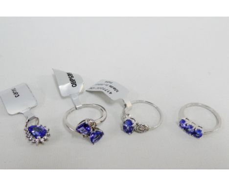 Three 9 carat gold tanzanite set dress ring and a white gold and tanzanite pendant (4) 