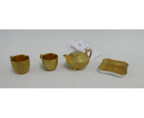 Coalport miniature table wares with turquoise jewelling against a gilt ground comprising a tray, teapot and two cups, (4) 