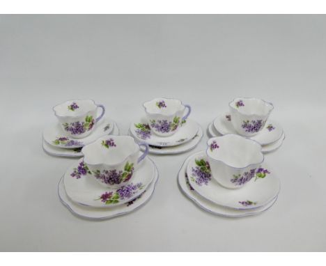 Shelley 'Lilac Time' bone china teaset, pattern number 14293, comprising five cups, seven saucers and six side plates, (18)